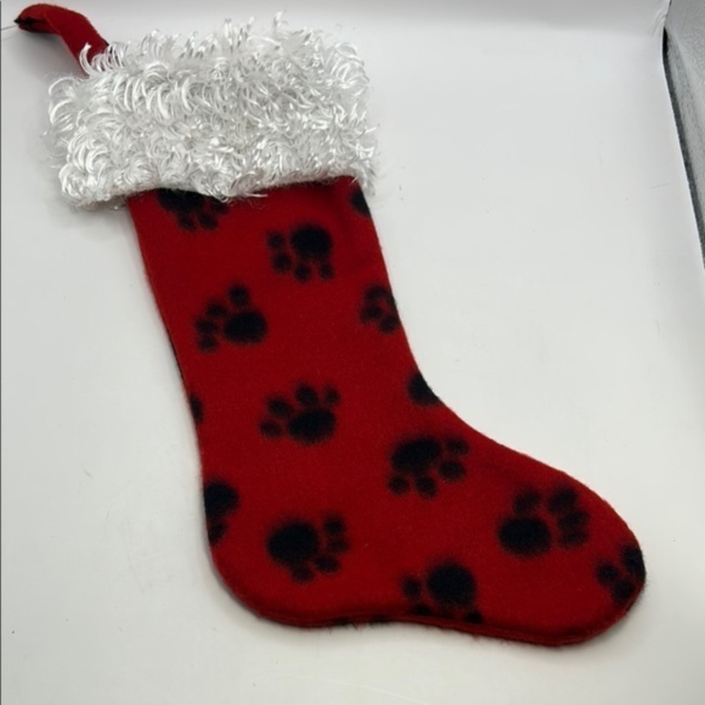 Red Christmas Stocking with Black Paw Prints.